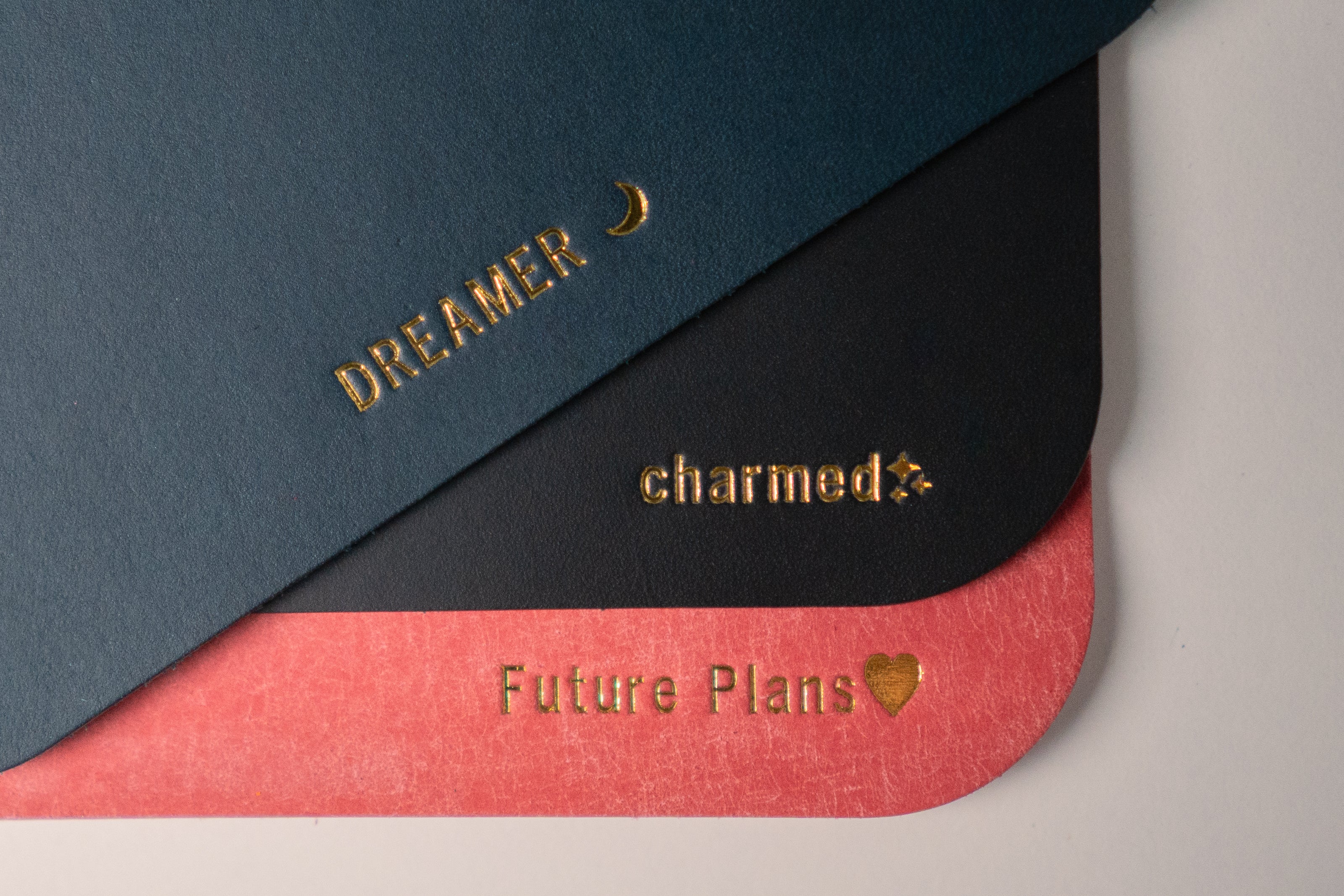 close up of gold embossing on leather journals